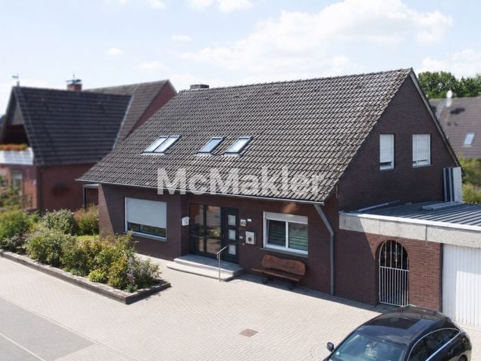 Ihr neues Zuhause in Greven-Reckenfeld: Zweifamilienhaus mit Garage, Garten und Mieteinnahmen – Foto 1