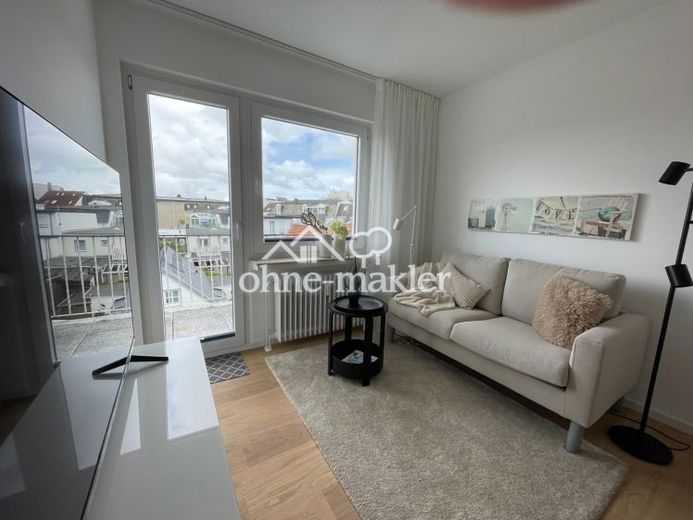 Above the rooftops of Norderney: Stylish 2-room apartment with sunny balcony – Photo 1