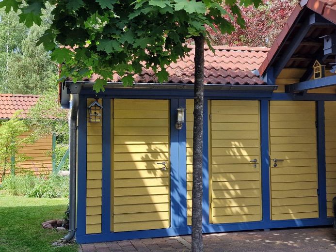 Casa de vacaciones con embarcadero propio en Hafendorf Rheinsberg – Schuppeneingänge