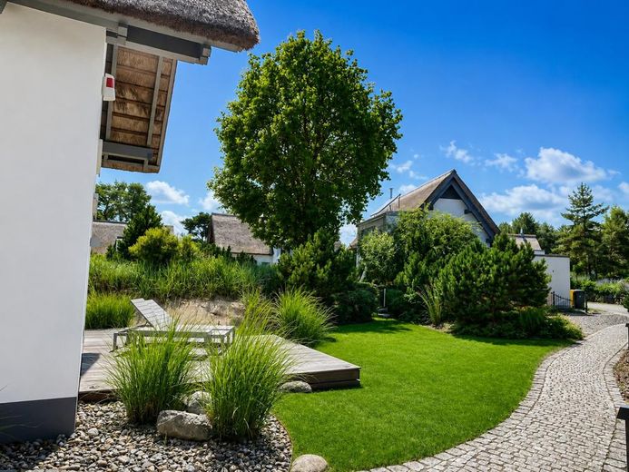Ihr Rückzugsort an der Ostsee Reetdachhaus mit Sauna, Kamin und Westterrasse in Karlshagen – Gartenzugang
