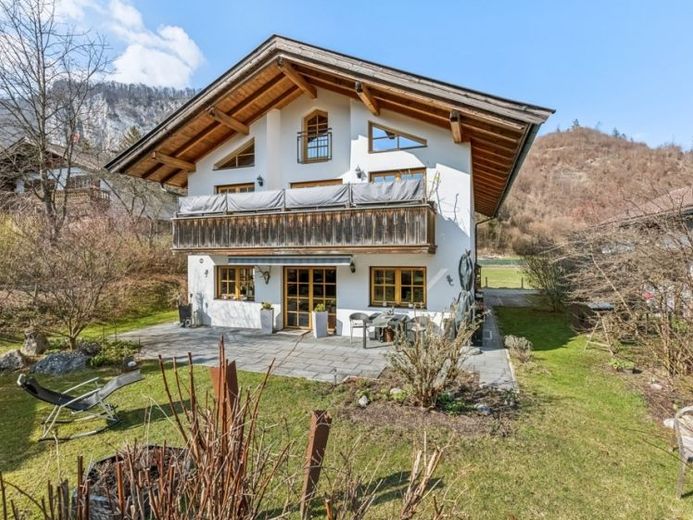 Appartamento di proprietà ben tenuto con vista sul Kaiser e ampio giardino in un gradevole edificio bifamiliare – Foto 1