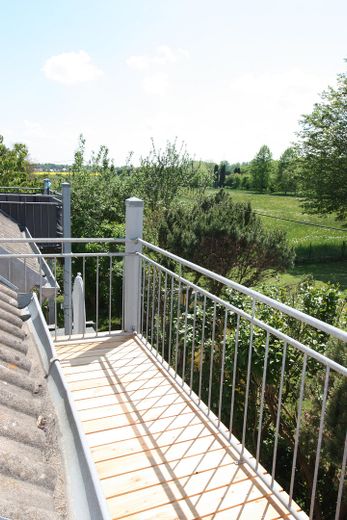 Stadtnahe lichtdurchflutete Maisonettewohnung mit Südbalkon am Waldrand – Ausblick Balkon