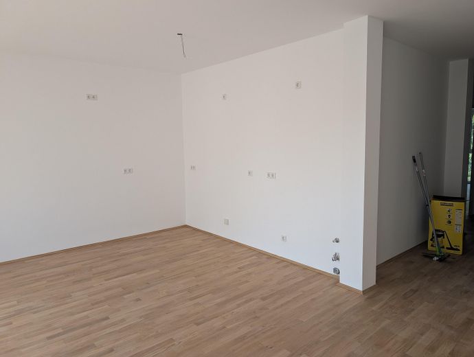 Erstbezug - Moderne geräumige Studio-Wohnung – Küchenwand mit Anschlüssen