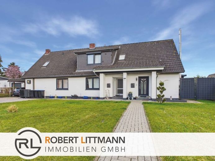 Zweifamilienhaus mit großem Garten und Wärmepumpe in Hambergen – Foto 1