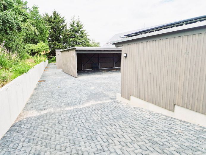EG Wohnung mit Terrasse | NACHHALTIGSTE Immobilie Wolfsburgs, Lehmbau, PV - Autarkie, Appsteuerung – Carportstellplatz