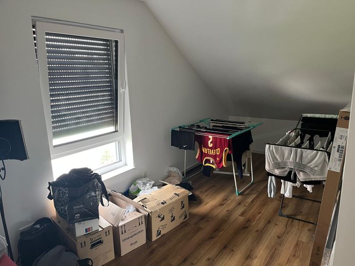 Appartamento moderno di nuova costruzione in posizione centrale a Holzhausen – Schlafzimmer / Büro