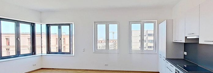 WOHNTRAUM IM ERSTBEZUG: Lichtdurchflutete 3-Zimmer-Wohnung mit EINBAUKÜCHE – Ansicht I: Wohn- und Esszimme…