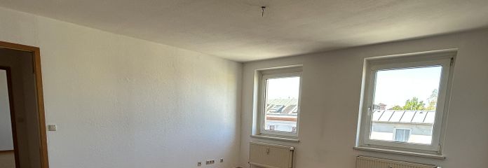 Appartement de 3 pièces au-dessus des toits du centre-ville sud – Wohnzimmer