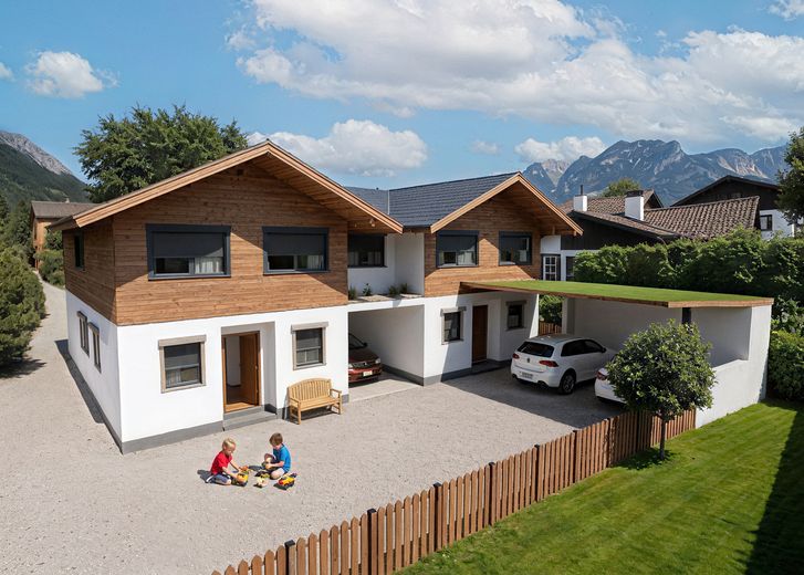 Wohnen mit Bergkulisse – massiv gebaut, für immer daheim – Ansicht aus Osten KI generiert