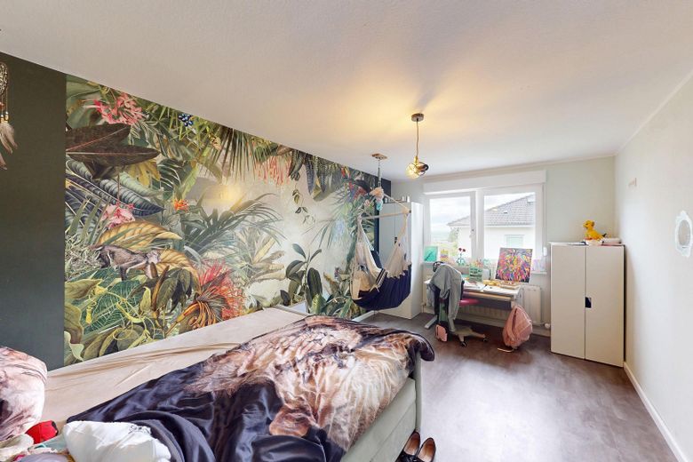 Renovated single-family home + self-contained apartment Roetgen – Schlafzimmer EG