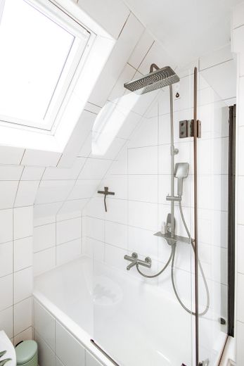 bathtub with rain shower