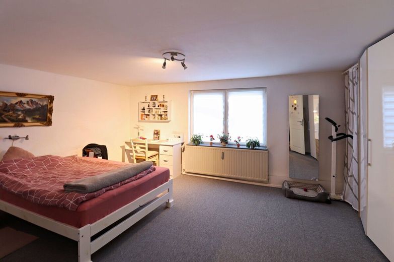 Mehrfamilienhaus mit Ausbaureserve in zentraler Lage von Lunden – Whg. I Schlafzimmer