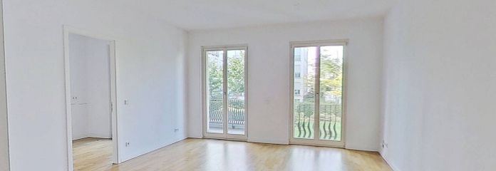 Elegantes Wohnen in Düsseldorf: Großzügige 3-Zimmer-Wohnung mit Balkon, Concierge-Service uvm. – Ansicht I: Wohn- und Esszimmer