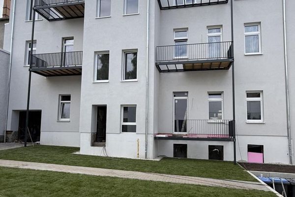Esclusivo appartamento mansardato con balcone in un edificio storico di epoca guglielmina completamente ristrutturato