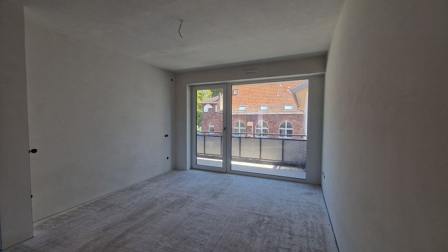 ERSTBEZUG - 2-Zimmer-Wohnung in bester Lage, Komfort und Ambiente im Neubau an der Klingenburg – Wohnzimmer
