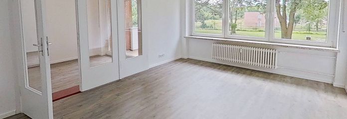 **Bis zu 3 NKM FREI** Große 3-Zimmer-Wohnung mit BALKON und intelligentem Grundriss in Kappeln-Ellenberg – Ansicht I: Wohn- und Esszimmer