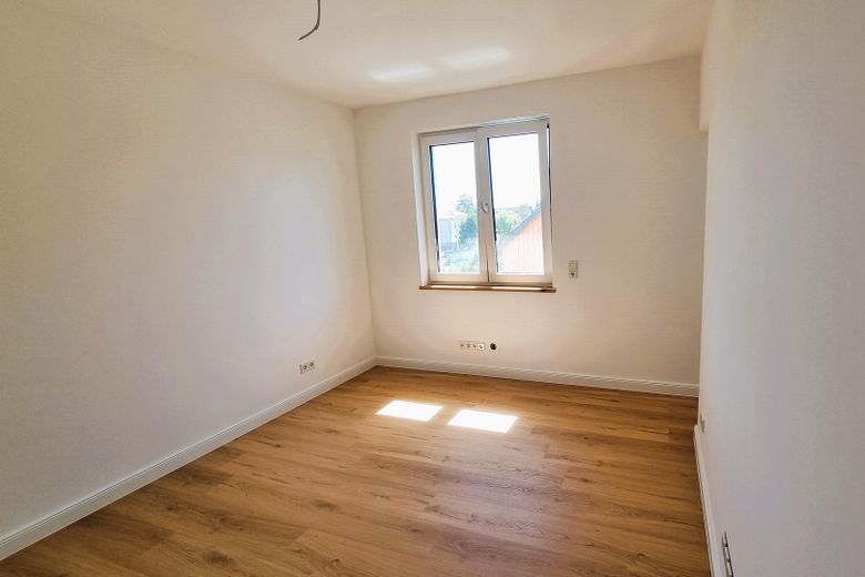Erstbezug im Grünen: Exklusive 3,5-Zi.-Wohnung mit Premium-EBK & privatem Garten – Schalfzimmer