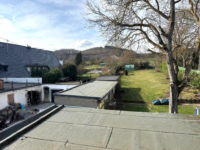 Vielseitiges Mehrfamilienhaus mit 3 Einheiten & attraktivem Baugrundstück – Garten/Baugrundstück