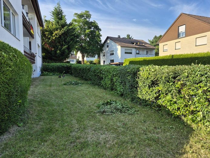 Helle 3-Zimmer-Erdgeschosswohnung mit Balkon und Garage in ruhiger Lage von Horn-Bad Meinberg – Garten des Hauses 4