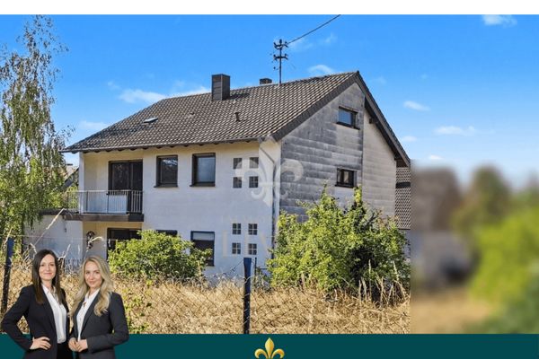 Detached two-family house with two separate residential units and a large plot