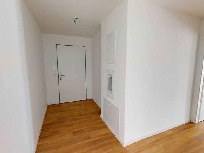 Modern wooncomfort: Lichtovergoten nieuwbouwappartement met 3 kamers, BALKON en INBOUWKKEUKEN – Ansicht II: Flur