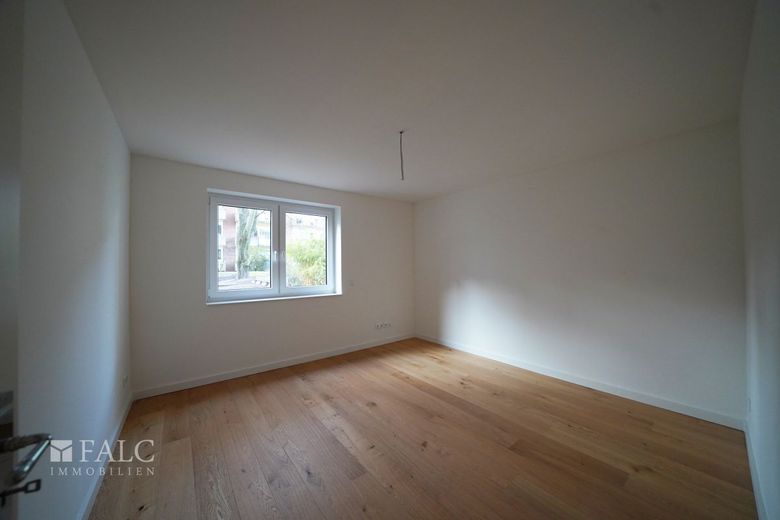 Energieeffizienter Neubau mit 3 Wohneinheiten und Business-Suite – WHG1-Schlafzimmer 2