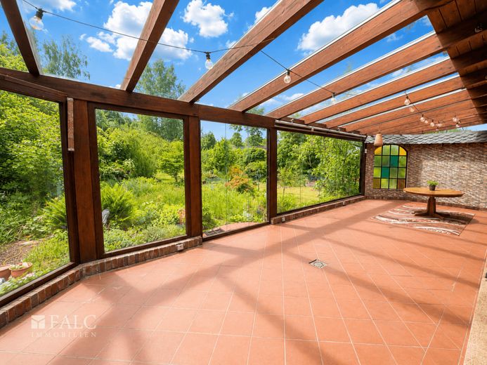 Gartenidylle mit Wintergarten-charmantes Einfamilienhaus zum Wohlfühlen in der Nähe von Langen – Wintergarten zum Grundstück