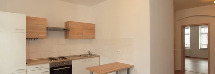 Appartamento al piano terra con 2 locali, cucina componibile e balcone