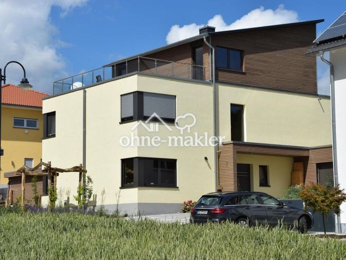 Provisionsfrei - Architektur trifft Natur: Lichtdurchflutetes Holzhaus mit Traumgarten & Fernblick – Foto 1