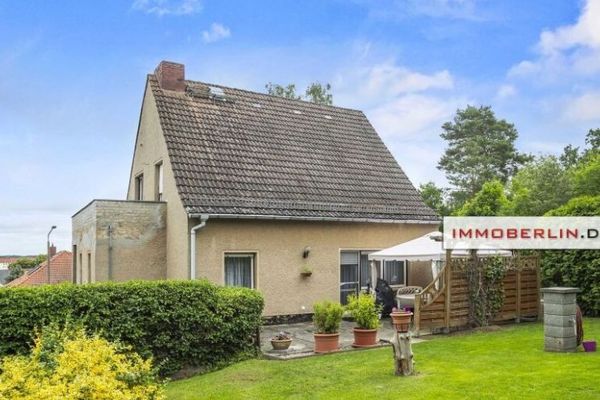 IMMOBERLIN.DE - Angenehmes Einfamilienhaus mit Westgarten & Garage in familiärer Lage