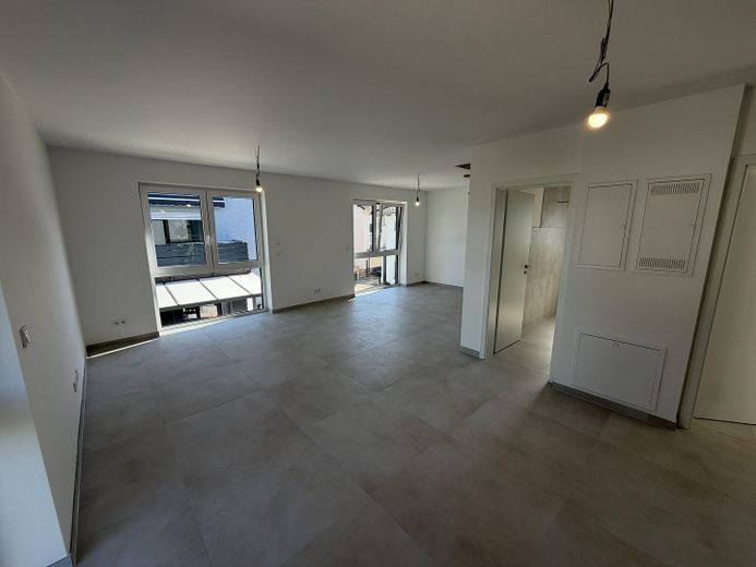 Première occupation d’une construction neuve exclusive – Élégant appartement-maisonnette de 3 pièces – Wohnzimmer Ansicht 2