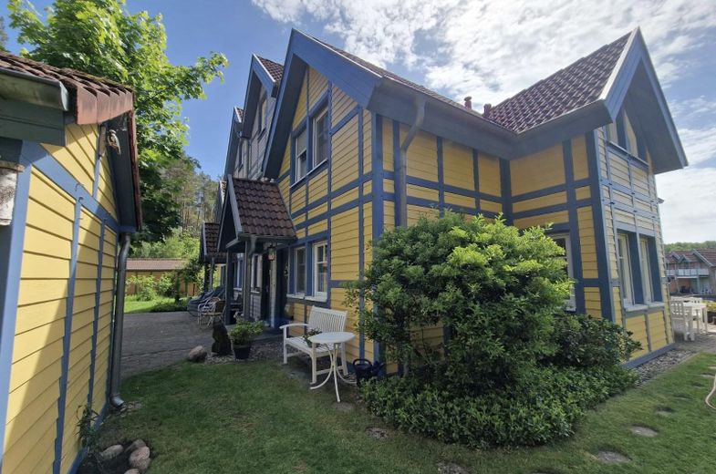 Casa de vacaciones con embarcadero propio en Hafendorf Rheinsberg – Blick vom Garten auf Eingang