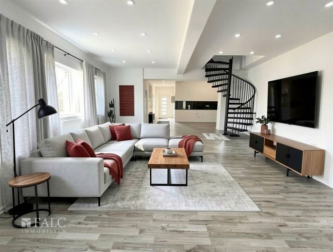 Attraktives Gesamtpaket: modernes Wohnhaus, vermietete Halle &amp; Baupotenzial – Wohnzimmer - (KI generiert)