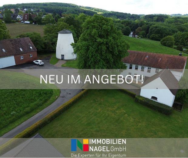 Charmantes Ein- bis Zweifamilienhaus mit Lagerflächen &amp; vielseitigem Entwicklungspotenzial – Titelbild