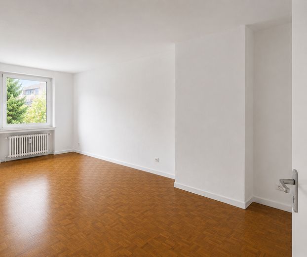 Exklusive Gartenwohnung im energetisch kernsanierten Mehrfamilienhaus – Wohnzimmer 