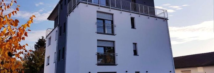 1-bedroom apartment with fitted kitchen and large south-facing balcony – Aussenansicht Haus